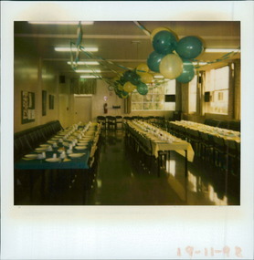 Photograph, Main dining room set for a celebration with balloons & streamers & tables set at Bundoora Repatriation Hospital Day Centre