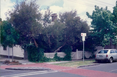 Photograph, A corner suburban house block with overgrown native tree in front yard - City Landscapes - Photo taken by Property Management Services / Public housing - Inner City Melbourne - Early 1980s