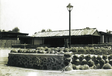 Photograph, A stone wall, landscaping, & buildings, all constructed by residents circa 1970s at Sandhurst Training Centre