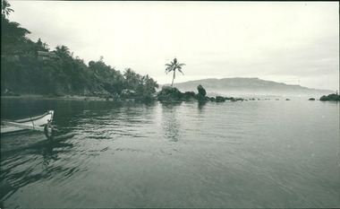 Photograph, View of the bow of a traditional Indonesian boat at Tan Tui beach sea garden and coral reef on Ambon Bay - Photo taken from Dr John Forbes photo albums on a trip taken to Ambon and its Hospital in 1971 through Ziarah the Gull Force Association Charity