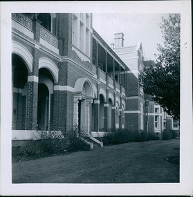 Photograph, The front facade, built in 1899, showing the existing elevation, of the Queen Victoria Ward, originally 'the women's ward',  Ballarat Hospital in September 1957 - Regional & District Hospital Collection - Department of Health & Human Services (DHHS)