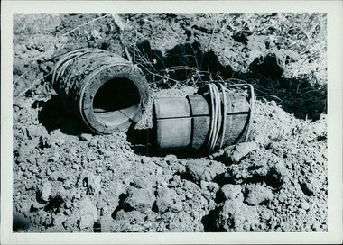 Photograph, These old style water pipes fittings, built with wood, were unearthed when excavating the Boort hospital site in 1961. The pipe on the right has a sleeve that is engineered to fit into the piece on the left - Note the wire that binds the wood together - Black & White Photos