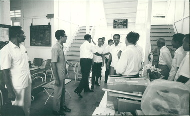 Photograph, Officials being greeted in the hospital lobby next to donated medical surgical & dental equipment in the foyer Ambon Hospital lobby - Donated through Gull Force Medical Aid programme Ziarah and Dr John Forbes & Fairfield Caltex Pacific Indonesia Ambon Hospital Circa 1970 to 1971
