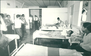 Photograph, Medical staff inspecting part of the women's ward of the hospital - Dr John A Forbes Fairfield / Gull Force 2/21 Bn AIF / Ziarah Caltex & Rumah Sakit Ambon Hospital - Photo is from Dr John Forbes photo albums - 1971