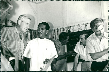 Photograph, Officials and medical staff and Australian contingent in informal discussions & settings inside the Hospital - MacFarlane Burnet to the let with Dr Forbes at the back of photo - Dr John A Forbes Fairfield / Gull Force 2/21 Bn AIF / Ziarah Caltex & Rumah Sakit Ambon Hospital - Photo is from Dr John Forbes photo albums - 1971
