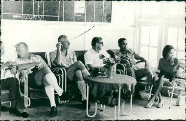 Photograph, Officials and medical staff and Australian contingent in informal discussions & settings inside the Hospital, MacFarlane Burnet 2nd from left, Dr Forbes 4th from left - Dr John A Forbes Fairfield / Gull Force 2/21 Bn AIF / Ziarah Caltex & Rumah Sakit Ambon Hospital - Photo is from Dr John Forbes photo albums - 1971
