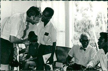 Photograph, Officials and medical staff and Australian contingent in informal discussions & settings inside the Hospital - Dr John A Forbes Fairfield / Gull Force 2/21 Bn AIF / Ziarah Caltex & Rumah Sakit Ambon Hospital - Photo is from Dr John Forbes photo albums - 1971