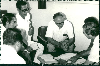 Photograph, Officials and medical staff and Australian contingent in informal discussions & settings inside the Hospital, Dr Forbes on right - Dr John A Forbes Fairfield / Gull Force 2/21 Bn AIF / Ziarah Caltex & Rumah Sakit Ambon Hospital - Photo is from Dr John Forbes photo albums - 1971