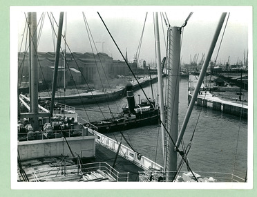 A large cargo ship entering the Royal Docks in the Port of London - Department of Health – National Fitness Office (Sports & Recreation) – Historical Press Release Photo Collection