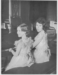 A photo of Princesses Margaret and Elizabeth sitting playing the piano - Department of Health – National Fitness Office (Sports & Recreation) – Historical Press Release Photo Collection