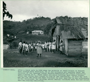 Bonnett Hill School rebuilt, white building in background, compared to the old school in foreground - The original school was destroyed in a heavy gale in 1944 - Jamaica - Department of Health – National Fitness Office (Sports & Recreation) – Press Release Photo - Empire Youth Day & Royal Tours
