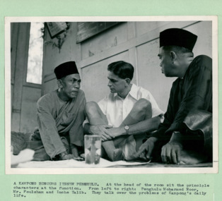 A Malaysian Kampong (Village) honours its new headman (Penghulu) Mohamed Noor, and Inche Talib, together with a British official Mr Foulsham - Department of Health – National Fitness Office (Sports & Recreation) – Historical Press Release Photo Collection