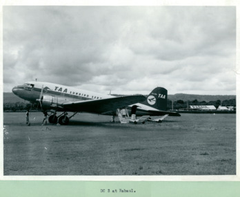A Trans Australian Airline (TAA) DC-3 parked on the tarmac at Rabaul, Papua New Guinea - Department of Health – National Fitness Office (Sports & Recreation) – Historical Press Release Photo Collection