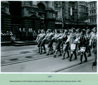 Girl Guides, of differing ethnicities, march past the Premier Henry Bolte who is standing on the salute base on Swanston Street, Melbourne CBD Australia with the Premier Henry Bolte taking the salute - 1961 - Department of Health – National Fitness Office (Sports & Recreation) – Historical Press Release Photo Collection