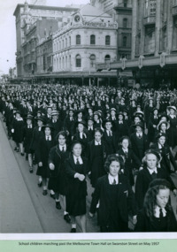 School children, from an unidentified school, march past the Melbourne Town Hall Swanston Street, Melbourne CBD Australia, from the War Memorial on May 1957 - Department of Health – National Fitness Office (Sports & Recreation) – Historical Press Release Photo Collection
