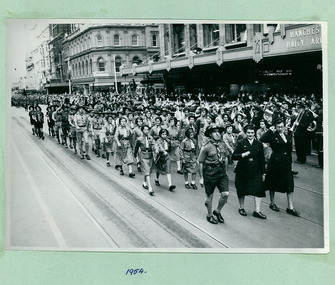 Girl Guides, Boy Scouts and Brownies march past the Melbourne Town Hall Swanston Street, Melbourne CBD Australia, from the War Memorial on May 1954 - Department of Health – National Fitness Office (Sports & Recreation) – Historical Press Release Photo Collection