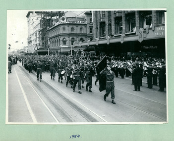 Army cadets (Note: Xavier on Bass Drum) march past the Melbourne Town Hall Swanston Street, Melbourne CBD Australia, from the War Memorial on May 1954 - Department of Health – National Fitness Office (Sports & Recreation) – Historical Press Release Photo Collection