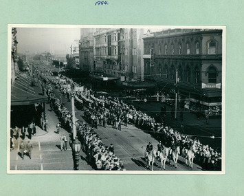 Mounted police followed by a brass band and Sea Cadets cross Collins Street on their way to Melbourne Town Hall on Swanston Street, Melbourne CBD Australia, from the War Memorial in 1954 - Department of Health – National Fitness Office (Sports & Recreation) – Historical Press Release Photo Collection