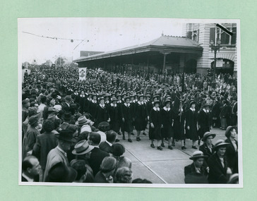 Different College groups marching past Flinders Street Station towards the salute base in front of the Melbourne Town Hall on Swanston Street, Melbourne CBD Australia, from the War Memorial - Department of Health – National Fitness Office (Sports & Recreation) – Historical Press Release Photo Collection