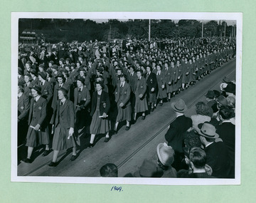A College group crossing Princes Bridge marching towards the Melbourne Town Hall on Swanston Street, Melbourne CBD Australia, from the War Memorial 1949 - Department of Health – National Fitness Office (Sports & Recreation) – Historical Press Release Photo Collection