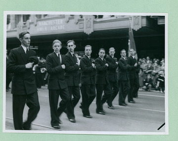 Eight college students taking the salute in front of the Melbourne Town Hall on Swanston Street, Melbourne CBD Australia, from the War Memorial - Department of Health – National Fitness Office (Sports & Recreation) – Historical Press Release Photo Collection