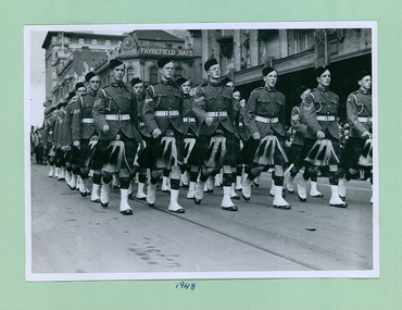 Highland Cadets marching past the salute base in front of the Melbourne Town Hall on Swanston Street, Melbourne CBD Australia - 1948, from the War Memorial - Department of Health – National Fitness Office (Sports & Recreation) – Historical Press Release Photo Collection
