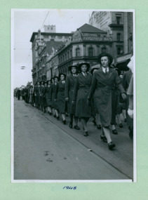 A group of unidentified young college women marching past the salute base at the Melbourne Town Hall on Swanston Street, Melbourne CBD Australia - 1948, from the War Memorial - Department of Health – National Fitness Office (Sports & Recreation) – Historical Press Release Photo Collection