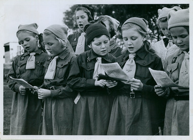Photos of Brownies singing a chorus at a rally held at the Camberwell Sports Ground in 1948, Melbourne, Australia - 5 of 5 photos - Department of Health – National Fitness Office (Sports & Recreation) – Historical Press Release Photo Collection