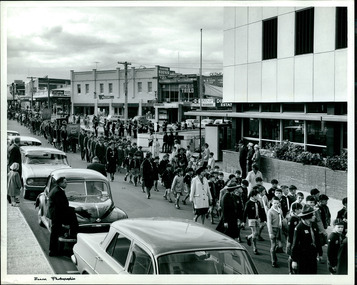 A street scene of Cub Scouts, school children and civilians attending a rally held in the City of Dandenong Circa 1960s, Melbourne, Australia - 2 of 2 photos - Department of Health – National Fitness Office (Sports & Recreation) – Historical Press Release Photo Collection