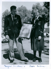 2 High School students of Northam High School in Western Australia holding a framed pledge - Message of Loyalty to Queen Elizabeth II, on 04/05/1958 - 2 of 3 photos - Department of Health – National Fitness Office (Sports & Recreation) – Historical Press Release Photo Collection