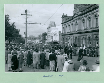 Participants of the march and civilians gather in front of Ballarat Council Building on Sturt Street - Note: Tram tracks, Gemmola Chemist and the Odeon in the distance - on Empire Youth day march held in Ballarat in 1958 - Department of Health – National Fitness Office (Sports & Recreation) – Historical Press Release Photo Collection