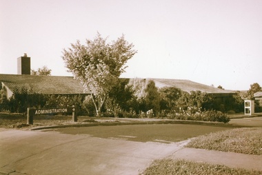 Photograph, Colanda Grounds - Exterior of Administration with telephone box