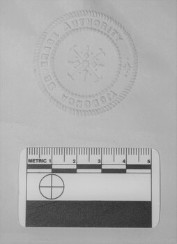 Imprint of the official seal of the Wodonga Sewerage Authority on paper.