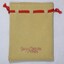 Front of a small faux suede jewellery pouch with a red draw string with the names "Sarah Coventry" and "Affinity".