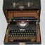 Black vintage typewriter in leather box