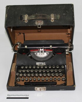 Black vintage typewriter in leather box