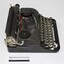Side view of black vintage typewriter 