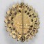 Back of an oval brooch from the Sarah Coventry jewellery range, with a pin clasp to attach it and a makers mark below the pin. 