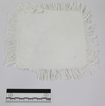 Haeusler Collection White Cotton Doily with Hand Stitched Fringe pictured with a 10cm scale