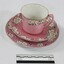 Haeusler Collection Teacup, Saucer and Cake Plate is pink with a flower pattern