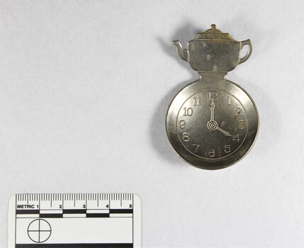 Haeusler Collection silver toned Tea Measure with clock face, pictured with 5cm scale