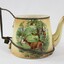 Side view of Haeusler Collection Teapot showing a print of two deer and a hunter in a woodland