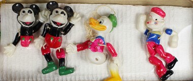 Haeusler Collection Walt Disney celluloid figurines with moving parts c.1930s, characters featured are Mickey Mouse, Donald Duck and Popeye.