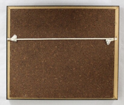 Back of a brown wooden fame on a copper plaque commemorating Sarah Coventry 10th Anniversary from 68-78.