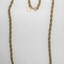Gold toned metal rope chain from the Sarah Coventry jewellery range, with a small rhombus-shaped attachment at the clasp. 