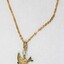 Detail of the back of the gold toned metal necklace with a small bird pendant and a small faux pearl. 