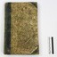 Front of a Wodonga Police register or diary used for recording day-to-day duties in 1855-1857, with a black and white 10 cm scale.