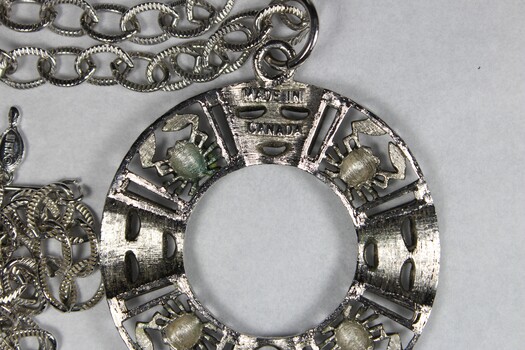 Makers mark of Silver toned Necklace from the Sarah Coventry jewellery range, "Astrology Zodiac" collection, c. 1970s - 1980s
