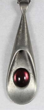 Detail of Silver toned Purple Pendant Necklace from the Sarah Coventry Jewellery Range c. 1970s-1980s showing purple glass bead
