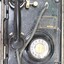 Vertical view of a black rotary dial flameproof telephone, with rubber tubing attached to the handset and a metal plate with the maker's name and the type and certification of the telephone.